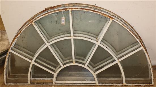 A set of three Victorian glazed metal fan lights W.155cm